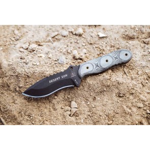TOPS Desert Son compact fixed blade knife featuring a black recurve blade with jimping and a layered, light-toned ergonomic Black Linen Micarta handle.